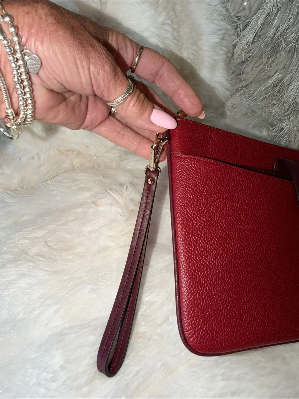 kate spade Burgundy Pebbled Leather Wristlet Clutch with Gold Tone Logo